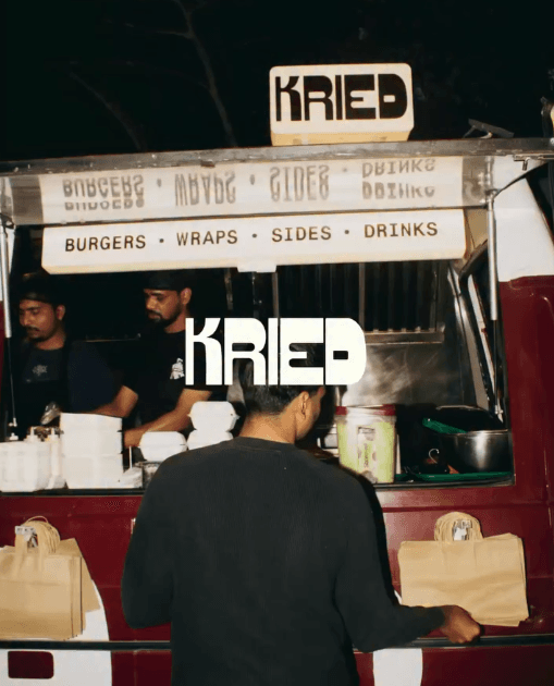 A vendor serving customers at their stand